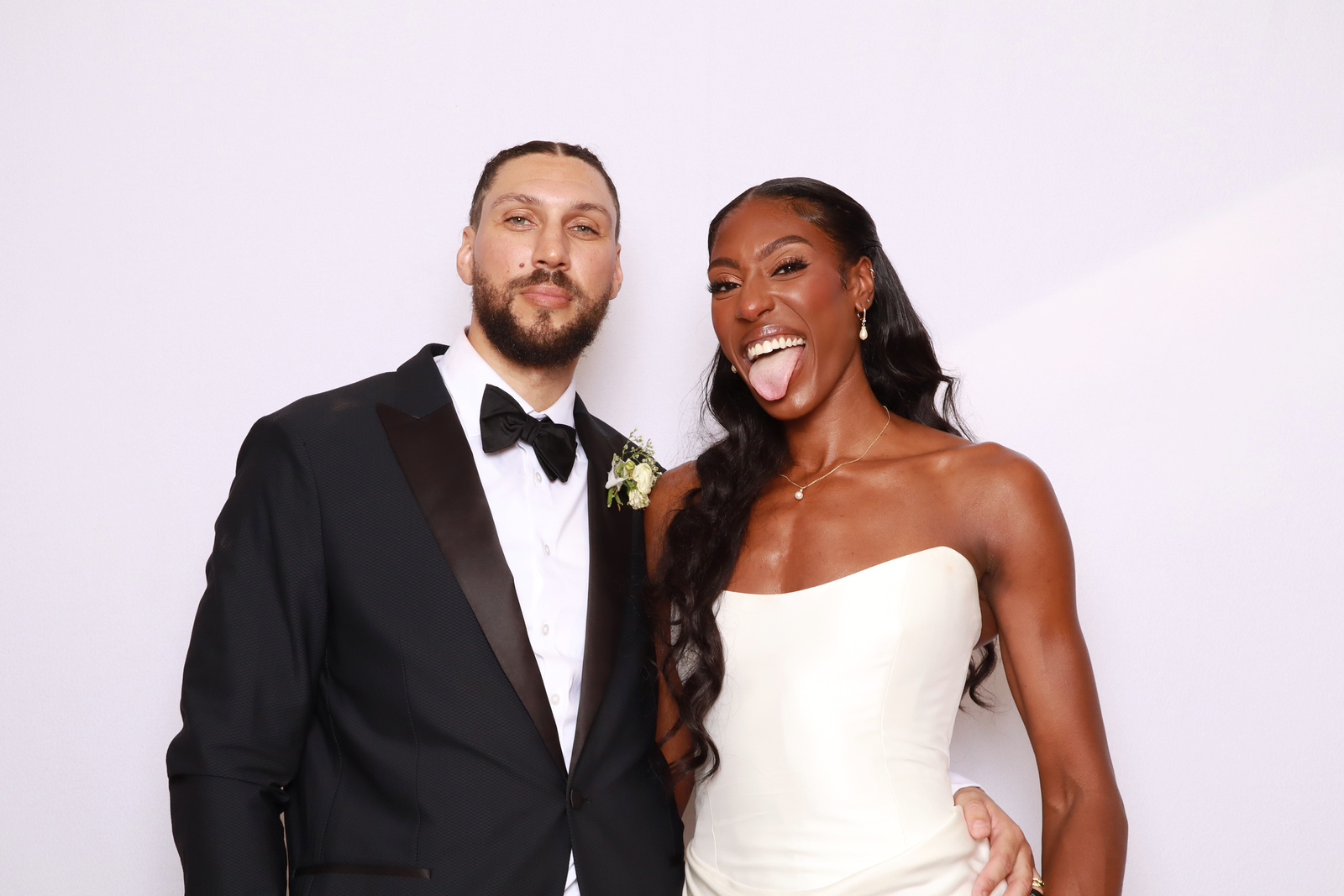 Newlyweds posing together in a ZimZoom photo booth