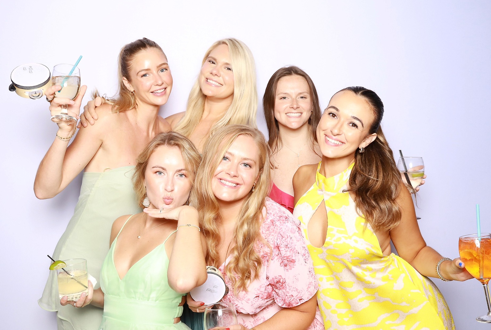 Wedding guests celebrating together in a ZimZoom photo booth