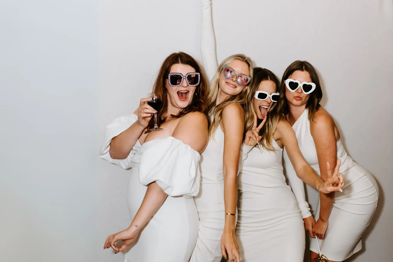 Friends celebrating together in a ZimZoom photo booth